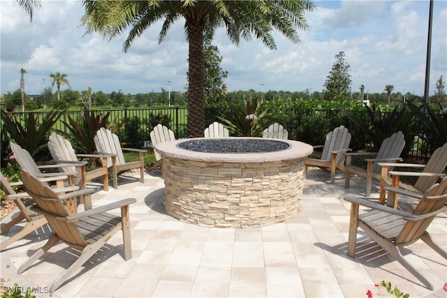 view of patio / terrace with an outdoor fire pit