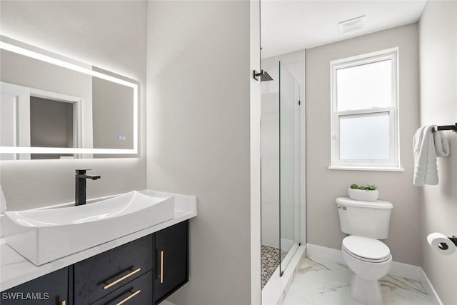 bathroom featuring a shower, vanity, and toilet