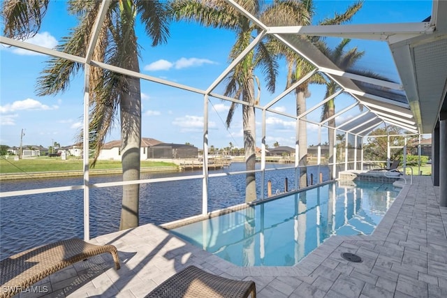 view of swimming pool featuring a patio area, a lanai, and a water view