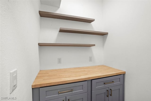 interior space featuring gray cabinetry and butcher block countertops