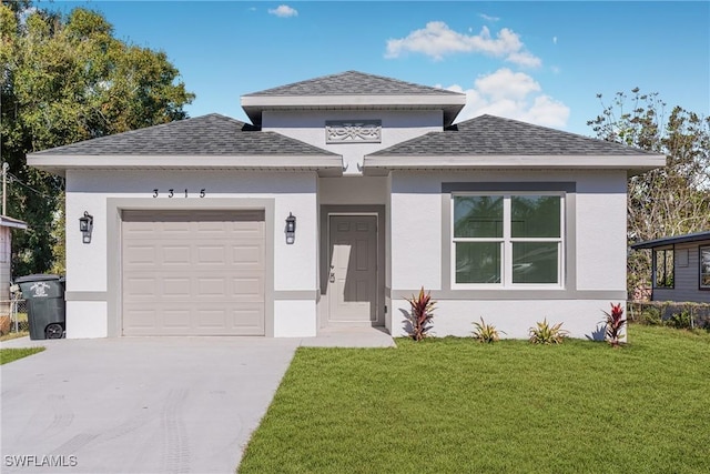 view of front of house with a front lawn and a garage