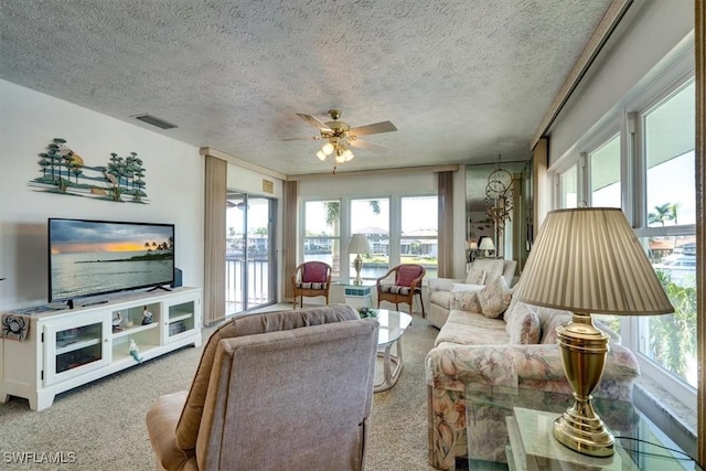 living room featuring a healthy amount of sunlight and a textured ceiling