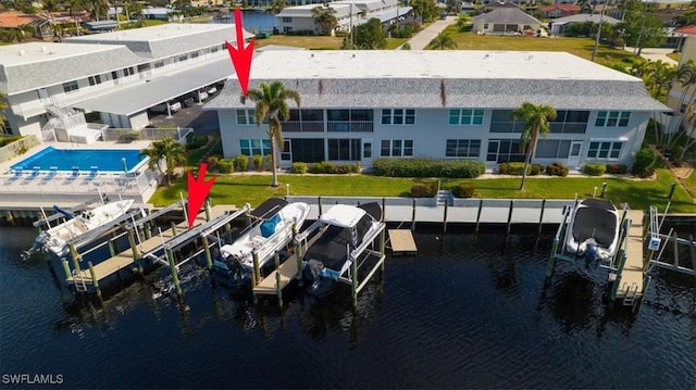 birds eye view of property featuring a water view