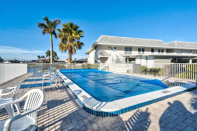 view of swimming pool featuring a patio