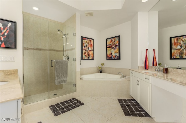 bathroom featuring tile patterned floors, vanity, and independent shower and bath