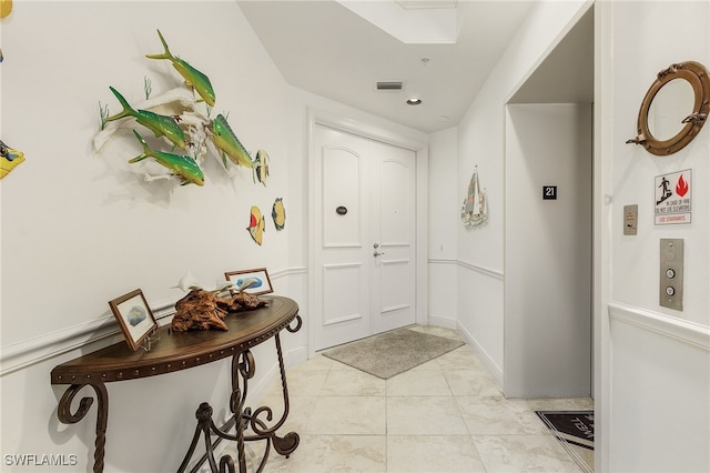 view of tiled foyer entrance