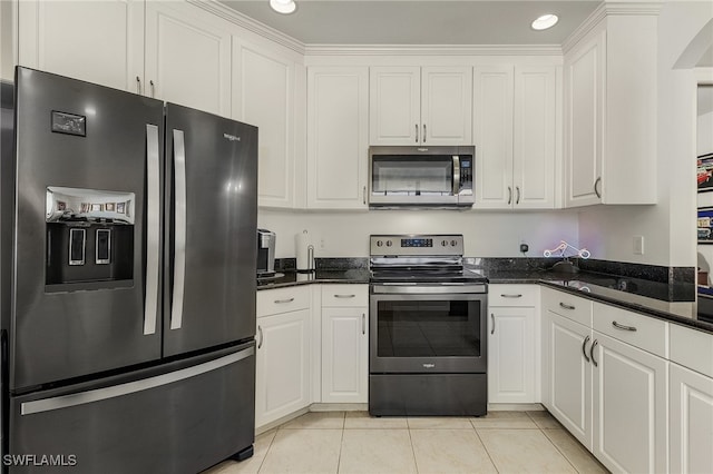 kitchen featuring white cabinets, light tile patterned floors, and stainless steel appliances