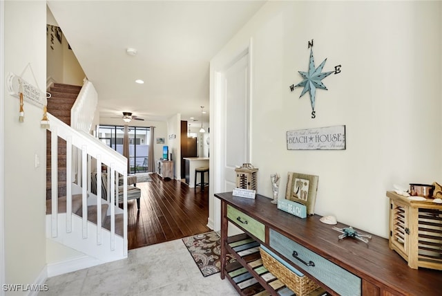 foyer featuring light hardwood / wood-style floors and ceiling fan