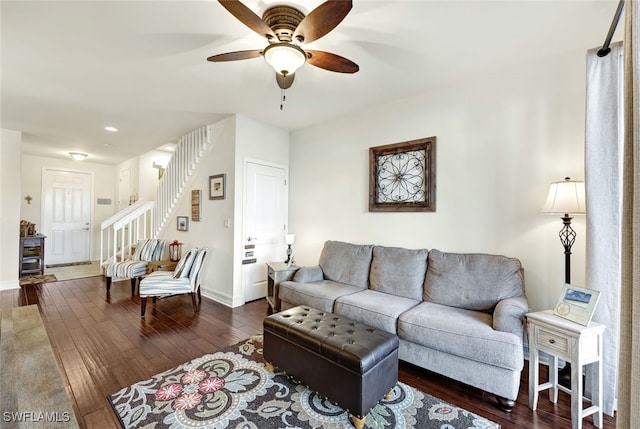 living room featuring dark hardwood / wood-style floors and ceiling fan