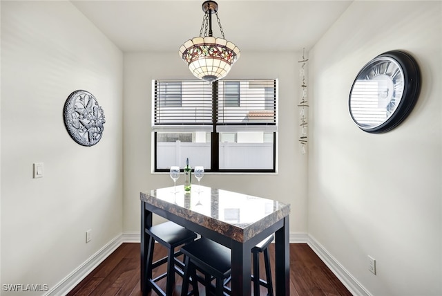 dining room with dark wood-type flooring