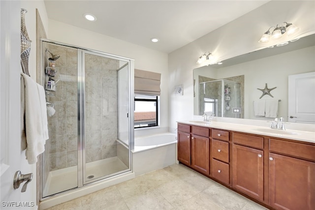 bathroom featuring shower with separate bathtub and vanity