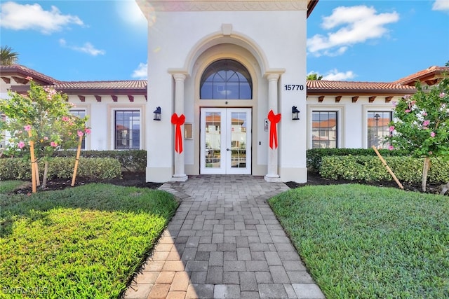 entrance to property featuring french doors