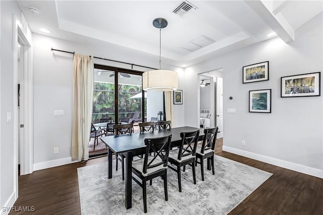 1140 Jeronimo Dr, Naples, FL 34103 - dining area featuring a tray ceiling, dark wood-style flooring, baseboards, and recessed lighting