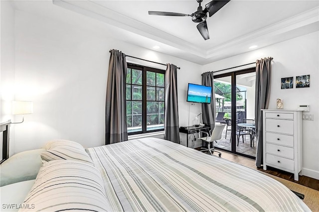 1140 Jeronimo Dr, Naples, FL 34103 - bedroom featuring access to outside, a tray ceiling, wood finished floors, recessed lighting, and ceiling fan