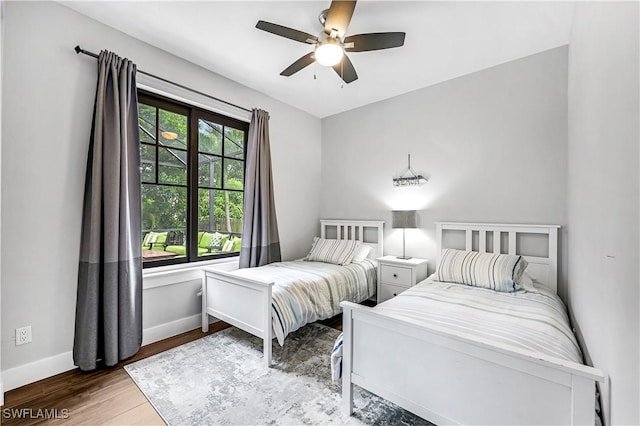 bedroom with ceiling fan and wood-type flooring