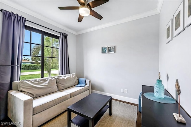 living room featuring hardwood / wood-style flooring, ceiling fan, and ornamental molding