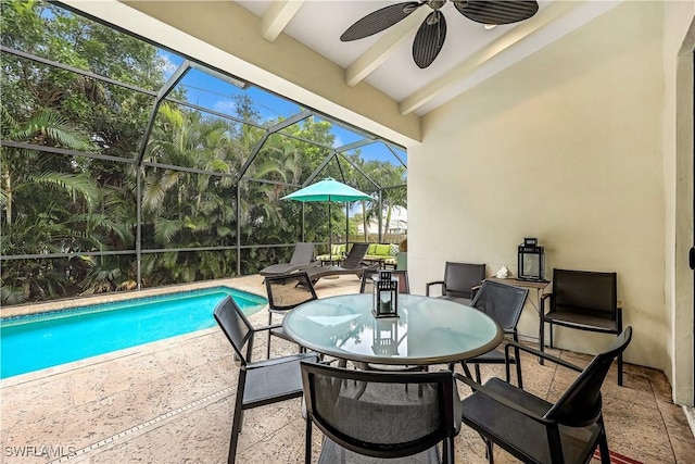 1140 Jeronimo Dr, Naples, FL 34103 - outdoor pool featuring a patio, ceiling fan, and glass enclosure