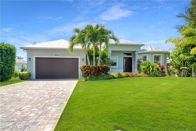 view of front facade with a front lawn and a garage