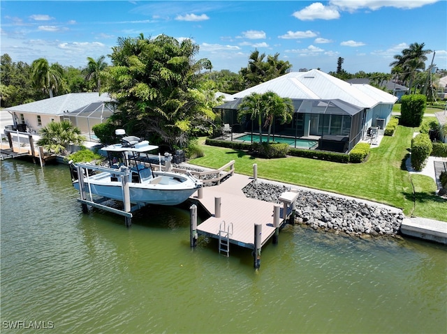 dock area featuring glass enclosure, a water view, and a yard