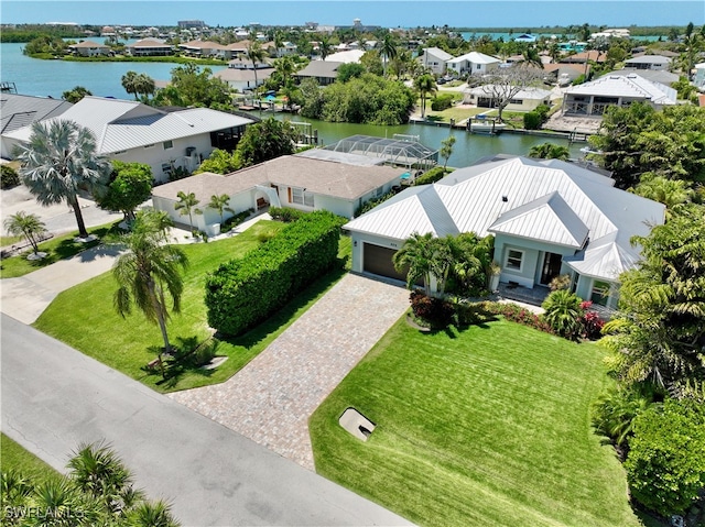 birds eye view of property featuring a water view