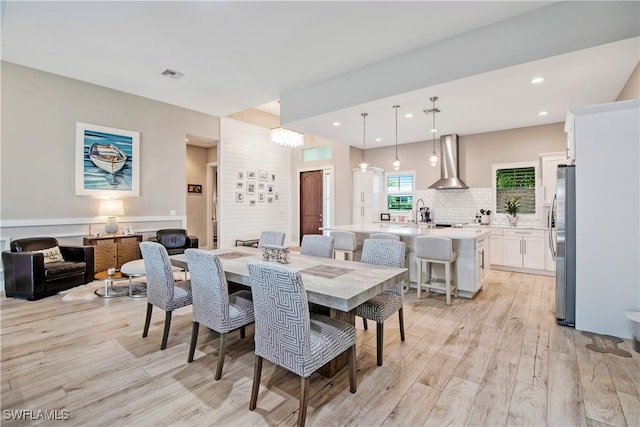 dining area with light hardwood / wood-style flooring