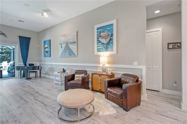 sitting room with light wood-type flooring