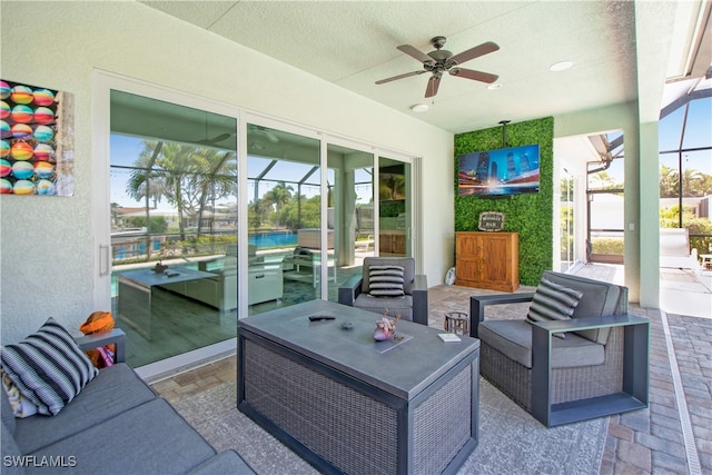 sunroom / solarium with ceiling fan