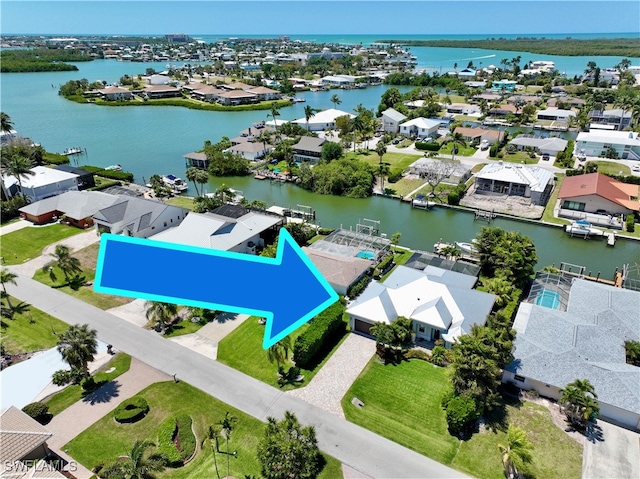 birds eye view of property featuring a water view