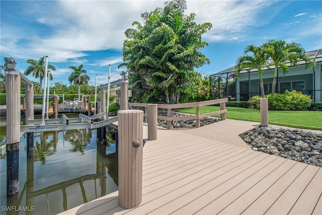 dock area featuring glass enclosure and a water view