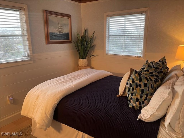 bedroom featuring multiple windows