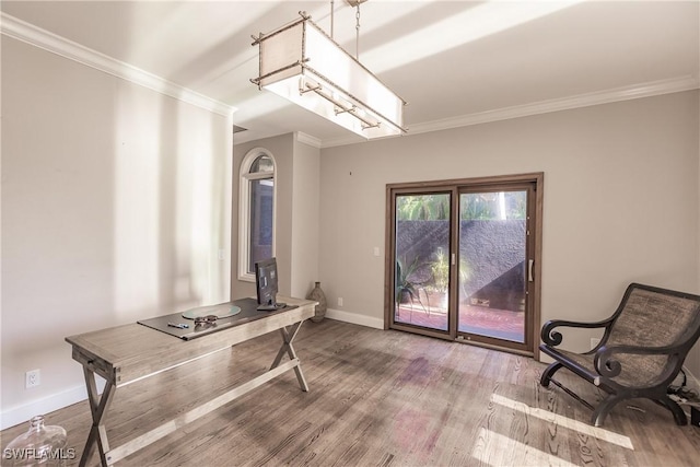 office area featuring hardwood / wood-style floors and crown molding