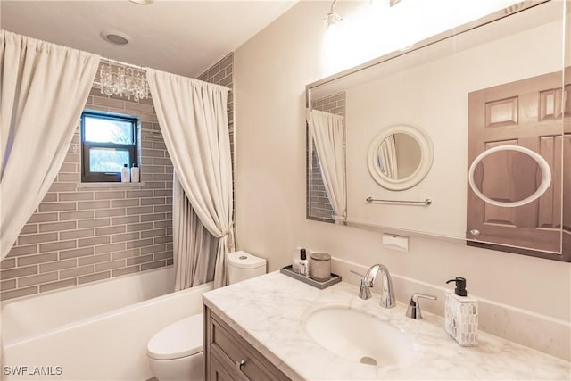 full bathroom with toilet, vanity, and shower / bathtub combination with curtain