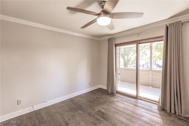 spare room featuring crown molding, ceiling fan, and dark wood-type flooring