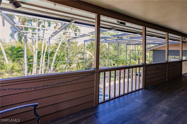 unfurnished sunroom with a wealth of natural light