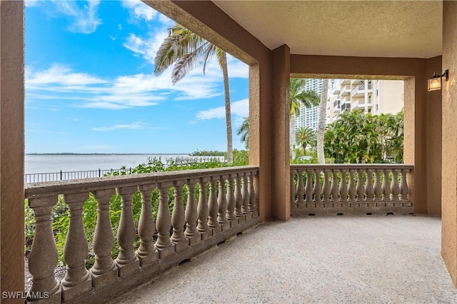 balcony featuring a water view