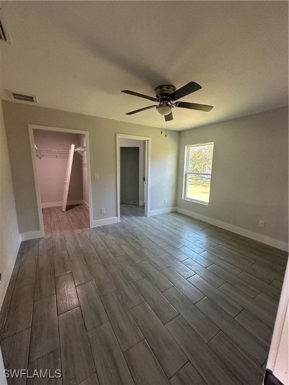 unfurnished room featuring wood-type flooring and ceiling fan