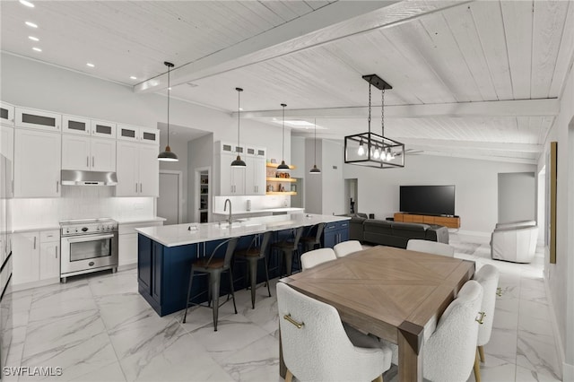 dining area featuring lofted ceiling with beams, wooden ceiling, and sink