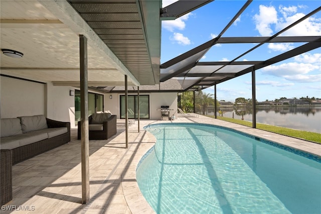 view of pool featuring outdoor lounge area, a water view, glass enclosure, and a patio