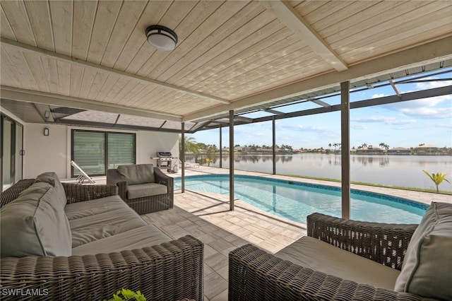 view of pool featuring a patio area, a water view, and an outdoor hangout area