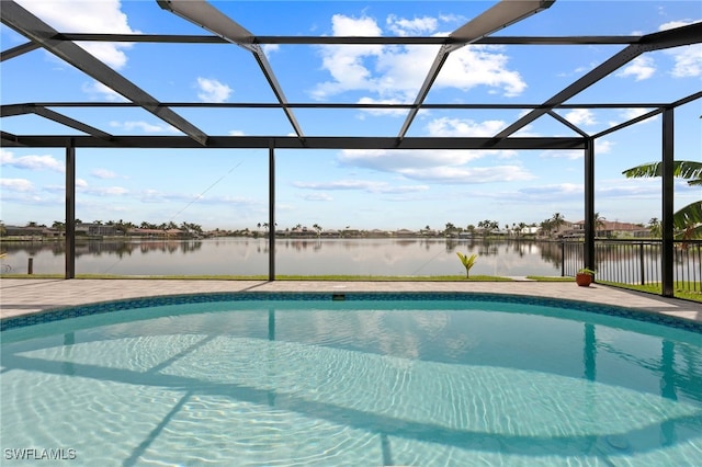 view of pool with a water view, a patio area, and a lanai