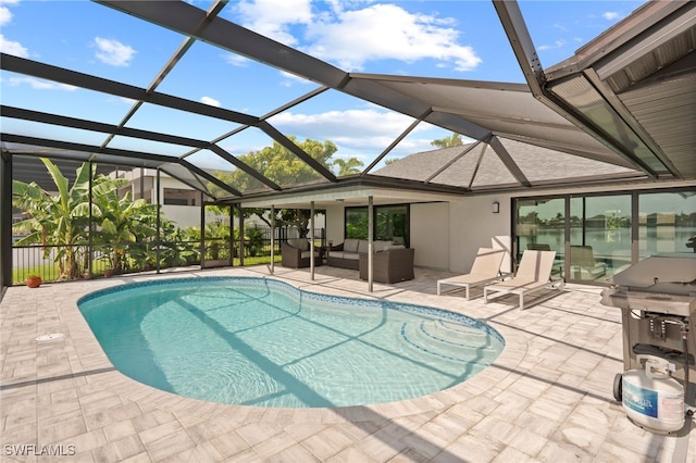 view of pool featuring a lanai, outdoor lounge area, area for grilling, and a patio