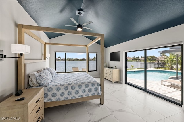 bedroom featuring ceiling fan, a textured ceiling, access to outside, and multiple windows