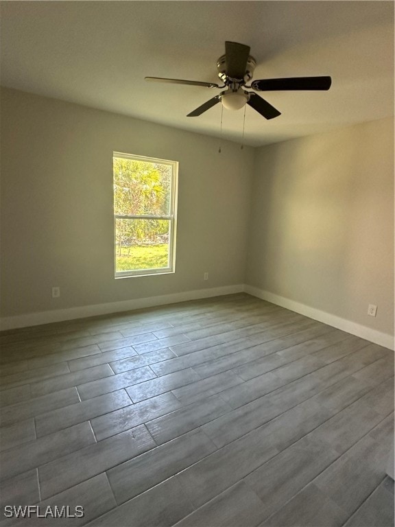 unfurnished room featuring ceiling fan and hardwood / wood-style flooring