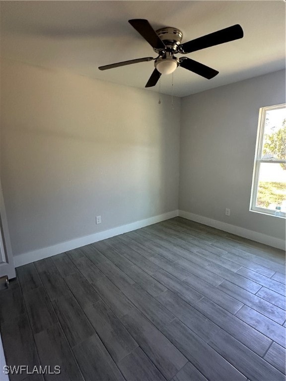 empty room with hardwood / wood-style flooring and ceiling fan