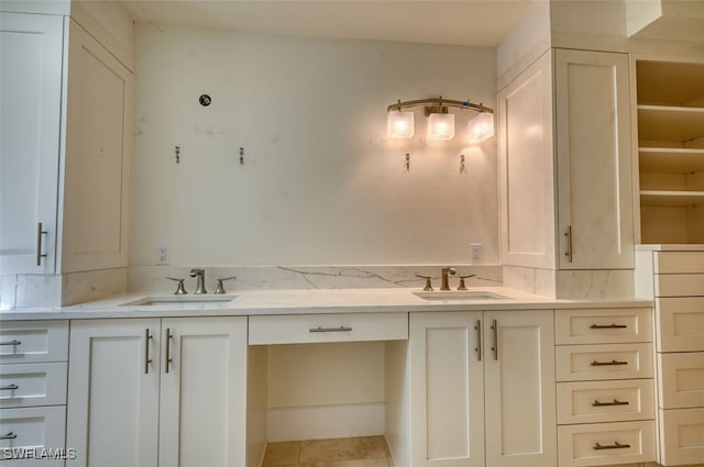 bathroom with tile patterned flooring and vanity