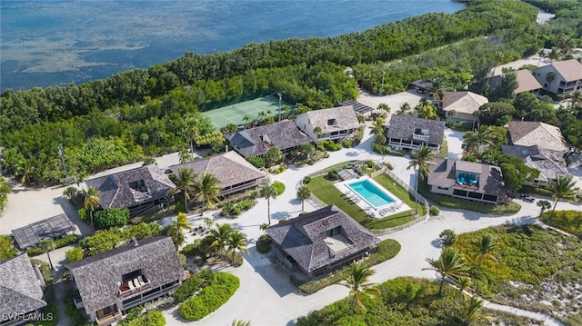 birds eye view of property with a water view