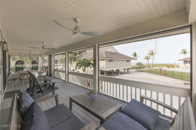 sunroom / solarium with ceiling fan