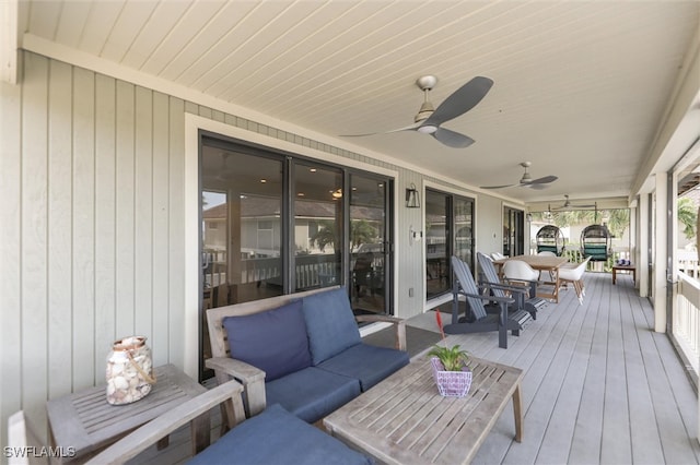 deck featuring an outdoor living space and a porch