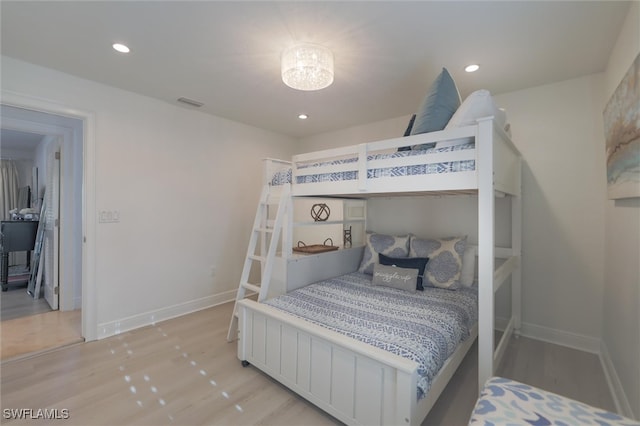 bedroom with light hardwood / wood-style flooring