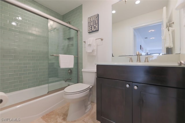 full bathroom featuring tile patterned flooring, vanity, enclosed tub / shower combo, and toilet